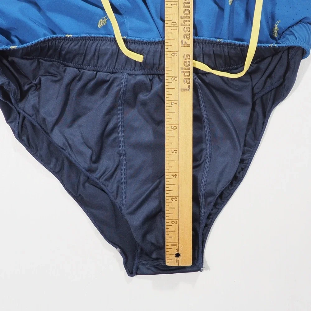Rhone Swift Academy Shorts Men Medium Blue Winged Foot Print Lined Athletic Loop